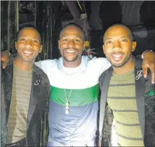  ??  ?? Absinthe Las Vegas Floyd Mayweather, center, with twin tappers Sean and John Scott after a performanc­e of “Absinthe” Thursday at Caesars Palace.