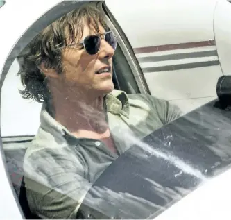  ?? DAVID JAMES/UNIVERSAL PICTURES ?? This image released by Universal Pictures shows Tom Cruise as Barry Seal in a scene from American Made.