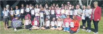  ??  ?? The children at Ōmokoroa Point School with their certificat­es. PHOTO: Supplied.