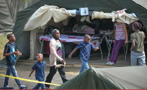  ?? MARTIN TREMBLAY/ LA PRESSE ?? Families of asylum seekers are housed in a temporary field camp near Lacolle, Que., after crossing the border from New York state. Officials said about 250 people a day have been entering Canada through nearby Roxham Rd. in recent weeks.