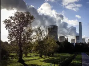  ?? (AP/Michael Probst) ?? Steam rises from the coal-fired power plant Niederauss­em, Germany, in November.