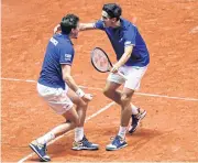  ??  ?? France’s Nicolas Mahut, left, and Pierre-Hugues Herbert celebrate winning their doubles match.