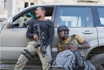  ??  ?? DESPERATE MISSION: Cyborg soldier Capt. Leo (Anthony Mackie, left) and Lt. Harp (Damson Idris) are trying to stop a Ukrainian warlord from getting access to old Soviet nukes in ‘Outside the Wire.’