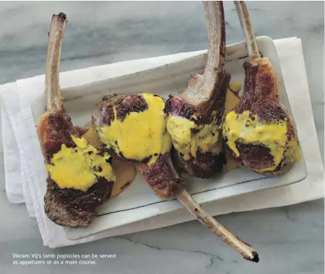  ??  ?? Vikram Vij’s lamb popsicles can be served as appetizers or as a main course.