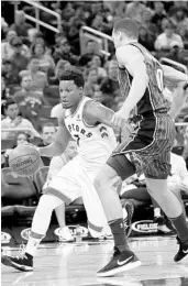  ?? JOHN RAOUX/ASSOCIATED PRESS ?? Raptors G Kyle Lowry, who scored a game-high 25 points, tries to drive past Magic F Aaron Gordon on Tuesday. Gordon had 16 points after missing the past five games.