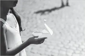  ?? GREGORIO BORGIA THE ASSOCIATED PRESS ?? A child holds an origami crane during a ceremony in Rome to mark the 73rd anniversar­y of the Aug. 6, 1945, atomic bombing of Hiroshima, Japan, by the United States.