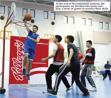  ??  ?? At the end of the basketball sessions, the participan­ts are divided into teams and play a series of games to practice their skills