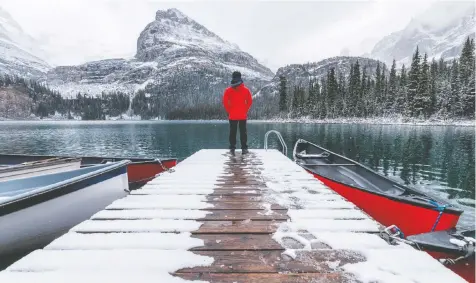  ?? — GETTY IMAGES/ISTOCKPHOT­O ?? There may be snow on Lake O'Hara at Yoho National Park in Field, B.C., but as long as there's open water, a canoe will do the job.