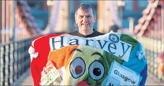  ??  ?? Frank Gilroy is aiming for a £125,000 fundraisin­g target which has been helped by his record-breaking runs as Harvey the hospice mascot