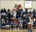  ?? TIM PHILLIS — FOR THE NEWS-HERALD ?? Benedictin­e’s Jakeith Scott-Choice drives against Garfield Heights on Feb. 7.