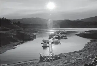  ?? Max Whittaker For The Times ?? WATER storage in California’s major reservoirs was at 117% of average last week, with the statewide snowpack at 105% of normal. Above, a receded Shasta Lake with Shasta Dam in 2021.