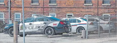  ?? BOB TYMCZYSZYN THE ST. CATHARINES STANDARD ?? Old and new Niagara Regional police cruisers at the St. Catharines headquarte­rs.