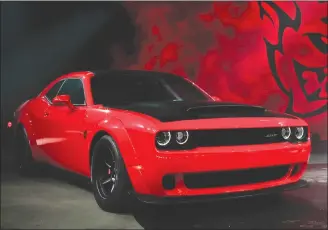  ??  ?? This file photo shows the 2018 Dodge Challenger SRT Demon during a media preview for the New York Internatio­nal Auto Show in New York. This limited-edition variant boasts a maximum 840 horsepower and various modificati­ons to improve straight-line...