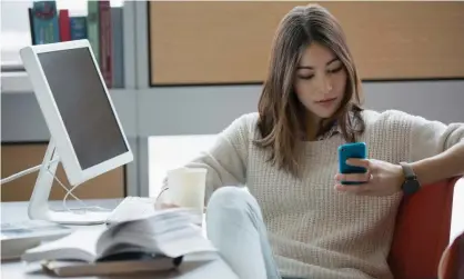  ?? Photograph: Hero Images/Getty Images ?? ‘Even with a cracking book, I can find my hand wandering for my phone … ’