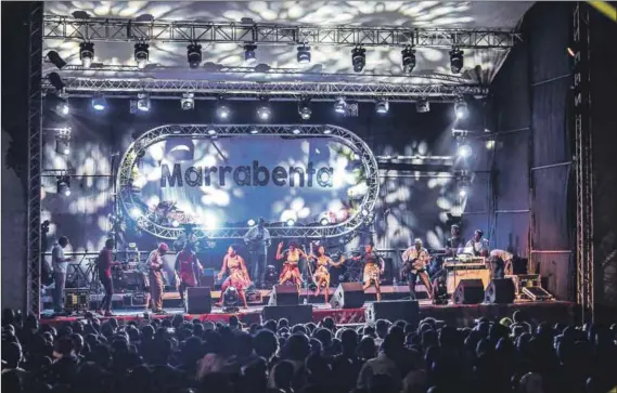  ??  ?? Compass: The Marrabenta Festival takes place at venues in various parts of Mozambique. Pictured above is an ensemble led by Dilon Djindji, often referred to as the king of marrabenta. Litho Sithoe, Ivan Iaranjeira, Simba Sitoi and Ermelinda Simela take a selfie at the festival. Photos: Ouri Pota