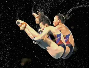  ??  ?? Tough battle: Cheong Jun Hoong (front) and Pandelela Rinong were pipped to the bronze by Canadians Meaghan Benfeito- Caeli McKay in the women’s 10m platform synchro event at the FINA Diving World Cup in Wuhan, China, yesterday.