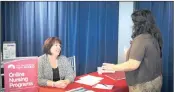  ?? PHOTO: BLOOMBERG ?? A representa­tive, left, advises a job seeker in Peoria, Arizona. US employment showed a gain of 180 000 for May.