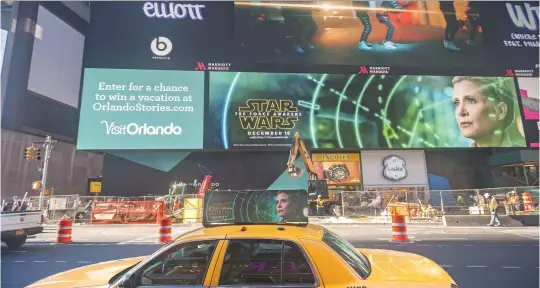  ?? (SIPA) ?? Advertisin­g for J.J. Abrams’ Star Wars: The Force Awakens on a giant LED screen in Times Square, New York, December 2015.