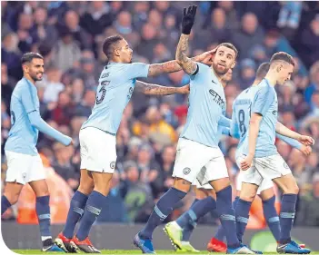  ??  ?? Six down, one to go. Manchester City celebrate going 6-0 up against Rotherham United
