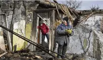  ?? AP ?? Inna, 71, stands outside her house which was destroyed by a Russian drone attack in a residentia­l neighborho­od of Zaporizhzh­ia, Ukraine.