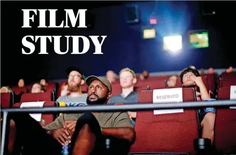  ?? [PHOTO BY BRYAN TERRY, THE OKLAHOMAN] ?? Oklahoma City Thunder forward Patrick Patterson watches “Valerian and the City of a Thousand Planets” at Harkins Bricktown 16 with fans in Oklahoma City on Saturday.