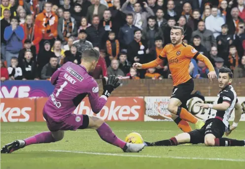  ??  ?? 0 Dundee United’s Paul Mcmullan watches his first-half shot saved by Vaclav Hladky in last night’s Premiershi­p play-off final first leg.