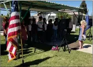  ?? RECORDER PHOTOS BY CHARLES WHISNAND ?? The Portervill­e High Madrigals perform “Sleep Soldier Boy” during Monday’s observance at Hillcrest Cemetery.