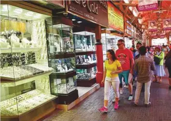  ?? Virendra Saklani/Gulf News ?? Shoppers at Deira Gold Souq. Non-registered businesses are still required to pay the 5 per cent VAT on their purchases of gold and diamonds.