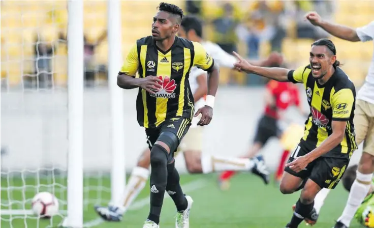  ?? Photo: Stuff ?? Roy Krishna of the Phoenix celebrates with David Williams after scoring a goal in the A-League match against Newcastle Jets.