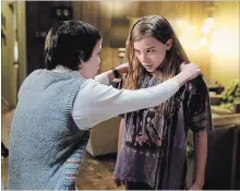  ?? SAEED ADYANI THE ASSOCIATED PRESS ?? Kodi Smit-McPhee, left, and Chloe Grace Moretz in "Let Me In."