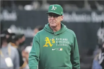  ?? AP PHOTO/JEFF CHIU ?? In this Aug. 20 file photo, Oakland Athletics manager Bob Melvin walks on the field before the team’s baseball game against the San Francisco Giants in Oakland, Calif.