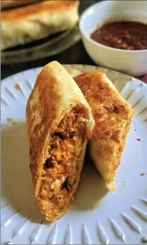  ?? GRETCHEN MCKAY / PITTSBURGH POST-GAZETTE ?? A flour tortilla stuffed with chorizo sausage, scrambled eggs, crispy potatoes and Mexican cheese makes the perfect breakfast-on-thego.