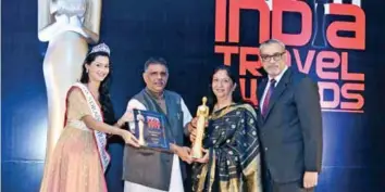  ??  ?? Radha Bhatia, Chairperso­n, Bird Group, joins the ‘Gallery of Legends’. She is felicitate­d by Gajendra Singh Khimsar, Cabinet Minister of Industries, DMIC, NRI, Sports & Youth Affairs, Government of Rajasthan, Dr. Tanushree Pandey, Mrs India 2015 and...