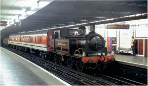  ??  ?? Do not rub your eyes! ‘Met 1’, marshalled at the rear of the top-and-tail train for the Barking to Upminster shuttles, pauses at
St James’ Park on the Southern arc of the Circle Line during a scarcely believable empty stock move from Neasden in the small hours of July 31 1990. Sadly, the locomotive set off a number of fires, destroying at least one garden shed on August 5, resulting in the second day of District Line specials being cancelled.