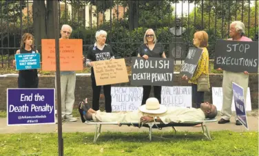  ?? Associated Press ?? Death penalty opponents protest this month outside the governor’s mansion in Little Rock. Arkansas carried out its fourth lethal injection in eight days at the Cummins Unit prison in Varner on Thursday.