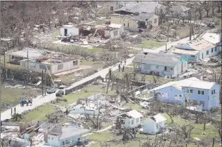  ?? Scott Olson / Getty Images ?? An aerial view of damage caused by Hurricane Dorian is seen on Great Abaco Island on Wednesday in Great Abaco, Bahamas. The official death toll reached 20.