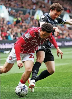  ?? ?? City’s Haydon Roberts comes under pressure from Oliver Rathbone