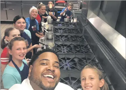  ?? SUBMITTED PHOTO ?? Chef Jarrett Young, a culinary instructor at Central Montco Technical High School, with students from the Create-a-Camp summer program he co-founded with Chef Maria Crann.