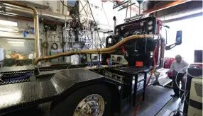  ?? (Allen J. Schaben/Los Angeles Times/TNS) ?? KESHAV SAHAY, manager of Heavy Duty Diesel Testing, looks at the exhaust of a 550 horsepower 2016 Peterbuilt truck with a Cummins ISX-15 diesel engine at the Air Resources Board’s truck and bus emissions testing lab last week in downtown Los Angeles.