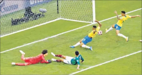  ?? AP ?? Brazil's Neymar (right), scores the opening goal against Mexico in the roundof16 match in Samara on Monday. This was Neymar’s sixth World Cup goal after his four in Brazil 2014.