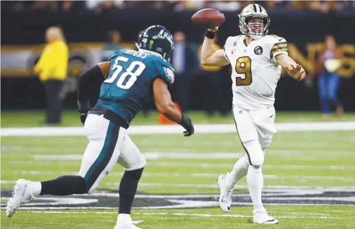  ??  ?? Le quart arrière Drew Brees et ses Saints de La Nouvelle-Orléans ont martyrisé les Eagles de Philadelph­ie plus tôt cette saison. Les deux équipes se retrouvero­nt dimanche dans un duel de deuxième tour des séries éliminatoi­res de la NFL. - Associated Press: Butch Dill