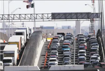  ?? Gerald Herbert / Associated Press ?? Vehicles line up to enter the U.S. from Mexico at a border crossing in El Paso, Texas, in March. Federal authoritie­s say data from an unidentifi­ed border point were hacked last month.