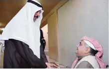  ??  ?? Deputy Prime Minister and Interior Minister Sheikh Mohammad AlKhaled Al-Hamad Al-Sabah greets a voter.