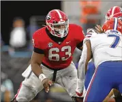  ?? JASON GETZ/JASON.GETZ@AJC.COM ?? Center and offensive captain Sedrick Van Pran will return to finish out his senior year with the Bulldogs, giving the national champs a solid foundation in the middle of the line.