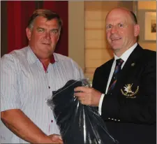  ??  ?? Stephen Hoey, winner of the Captain’s Prize to 5-Day Members, is presented with his prize by Laytown & Bettystown Captain Denis Taylor.
