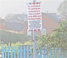  ?? — AFP photo ?? Posters have appeared in Loyalist areas of West Belfast, calling off planned protests in Belfast, Northern Ireland following the announceme­nt of the death of Prince Philip.