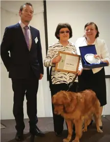  ??  ?? Michael Maunsell (Contest Chair), Emer Mulhall and Trudy her guide dog and Jane Mooney (Division D Director).