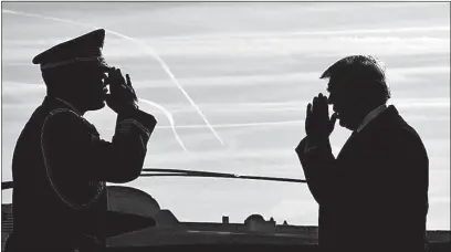  ?? [SUSAN WALSH/THE ASSOCIATED PRESS] ?? President Donald Trump, here being saluted as he walks down the steps of Air Force One, fired off a series of tweets Sunday criticizin­g the FBI.