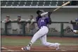  ?? JENNIFER FORBUS — FOR THE MORNING JOURNAL ?? Lake Erie’s Aaron Hill follows the ball he hit during the Crushers’ game against the Windy City ThunderBol­ts on Aug. 20.