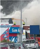  ??  ?? Clouds of smoke cover the Lower Hutt suburb, forcing the evacuation of nearby buildings.